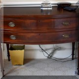 F40. Pair of 2-drawer mahogany side tables. 32”h x 41”w x 18”d (One leg needs repair.) 